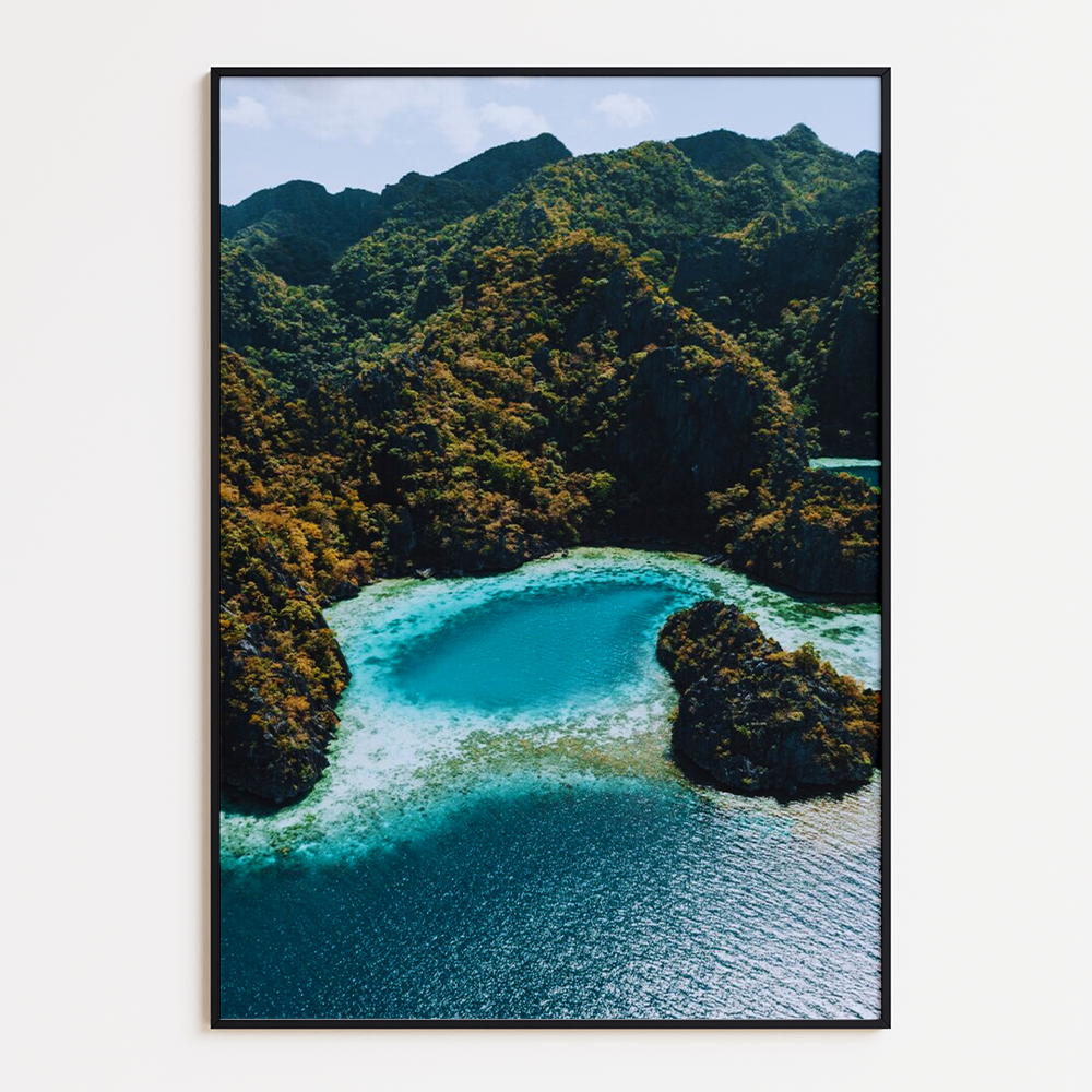 Aerial shot ocean surrounded by mountain